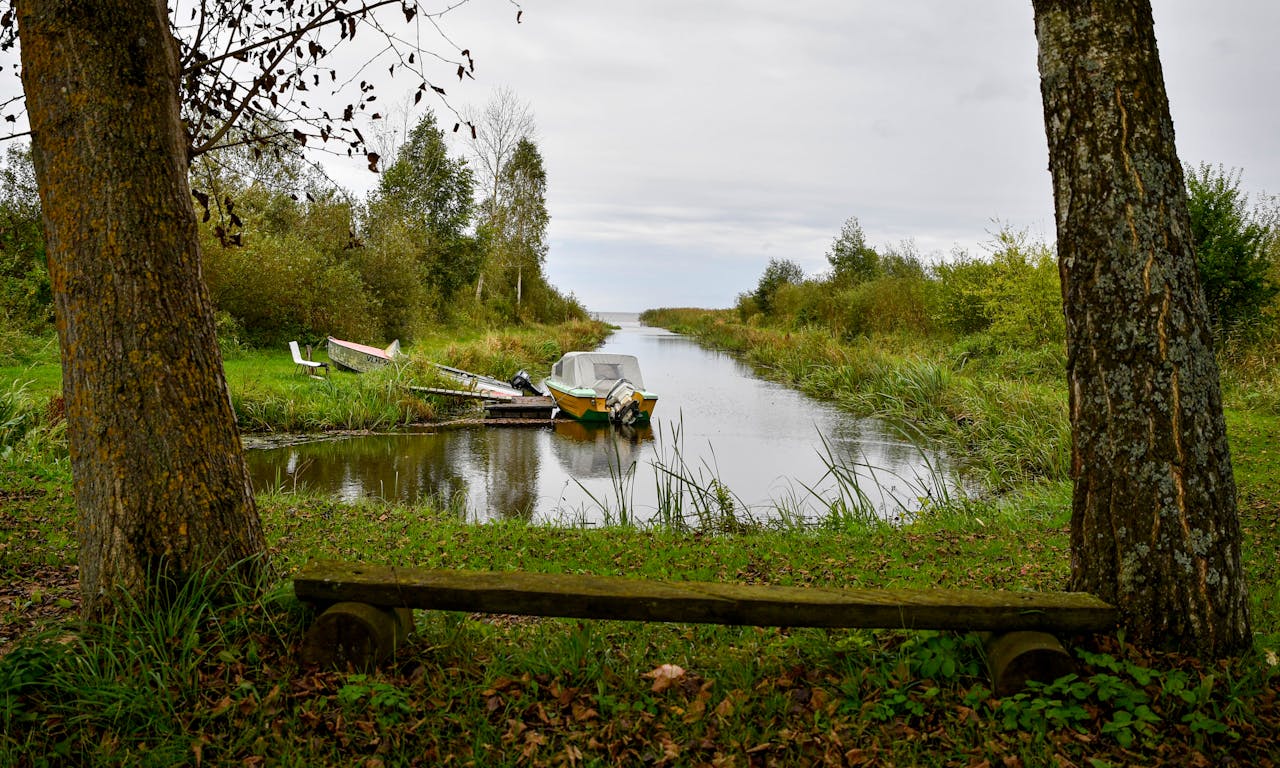 Services Peaceful autumn view of a fisherman boat by Lake Peipsi in Tartu County, Estonia.